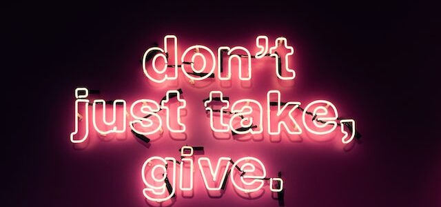 don't just take, give in big neon lights